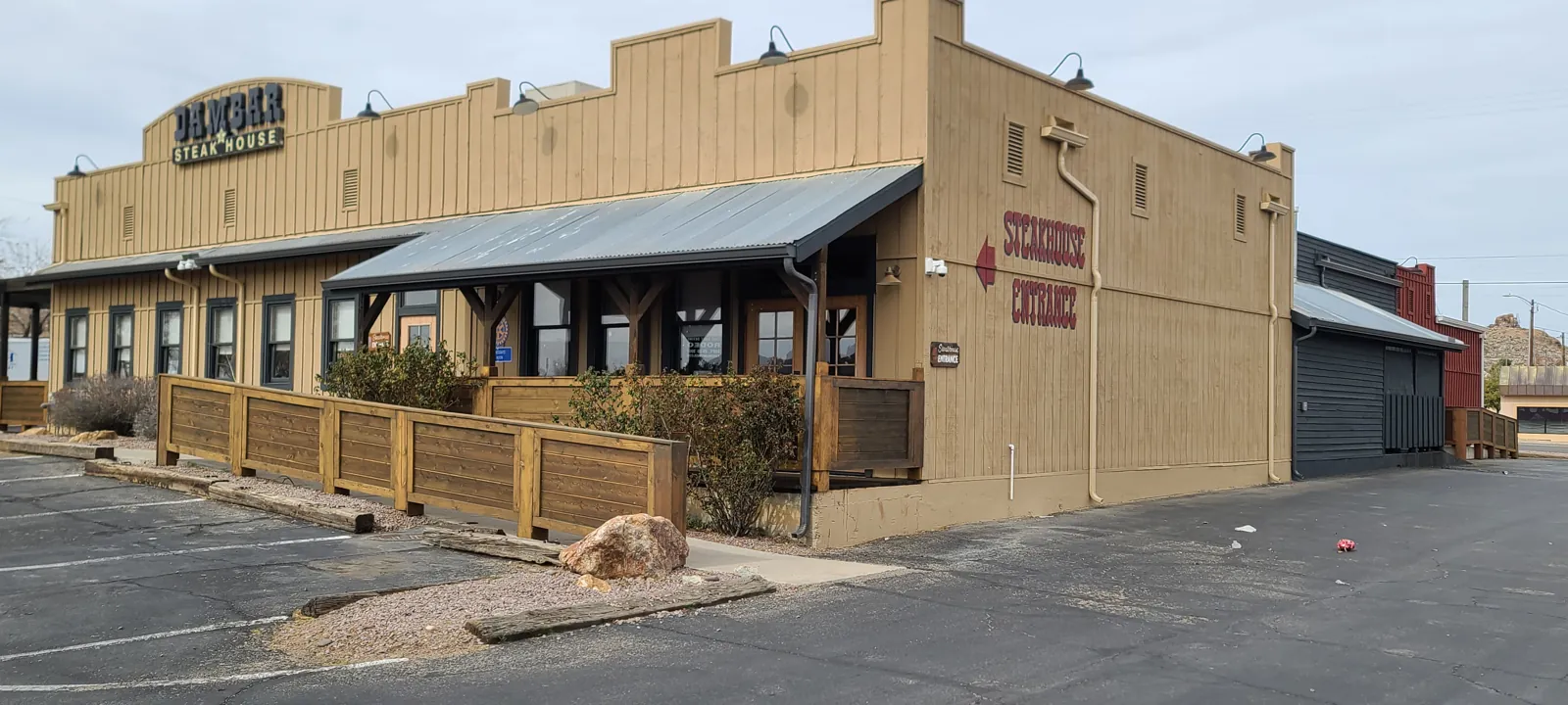Seamless gutters and downspouts on a western-style commercial steakhouse in Kingman, AZ