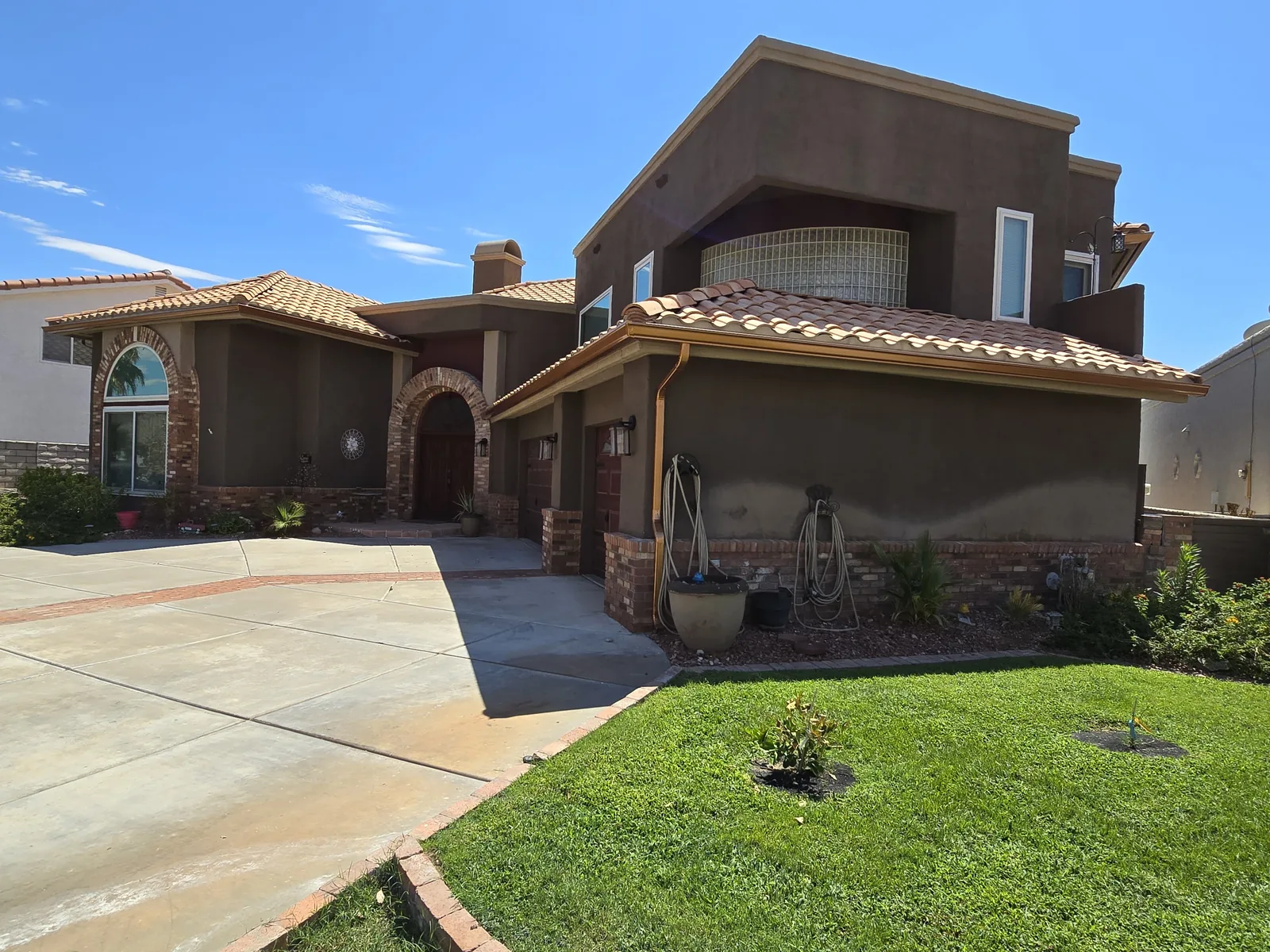 Genuine copper seamless gutter and downspout on a two-story brick-accent home in Laughlin, NV