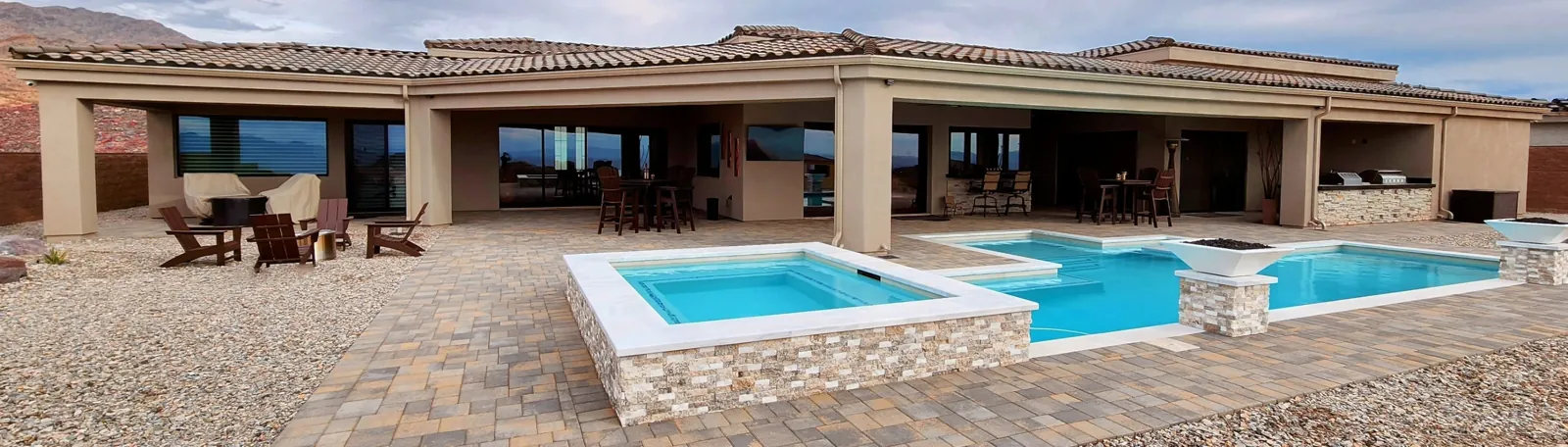 Seamless gutters along the eaves of a single-story desert home with a pool in Lake Havasu City, AZ