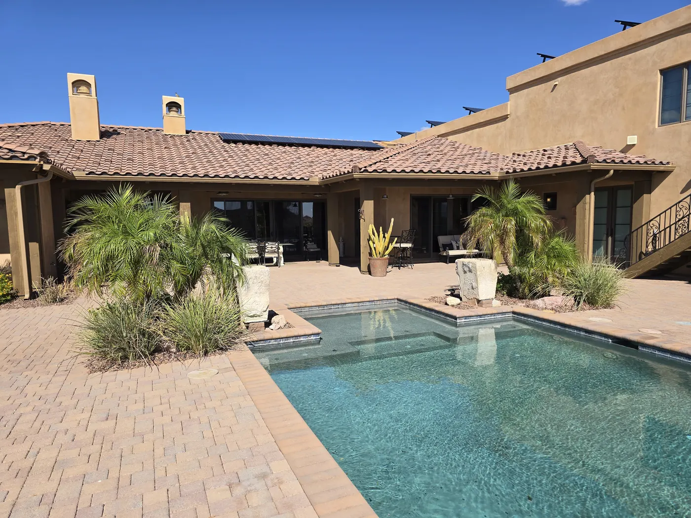 Seamless aluminum gutters on a pueblo-style courtyard pool home in Lake Havasu City, AZ