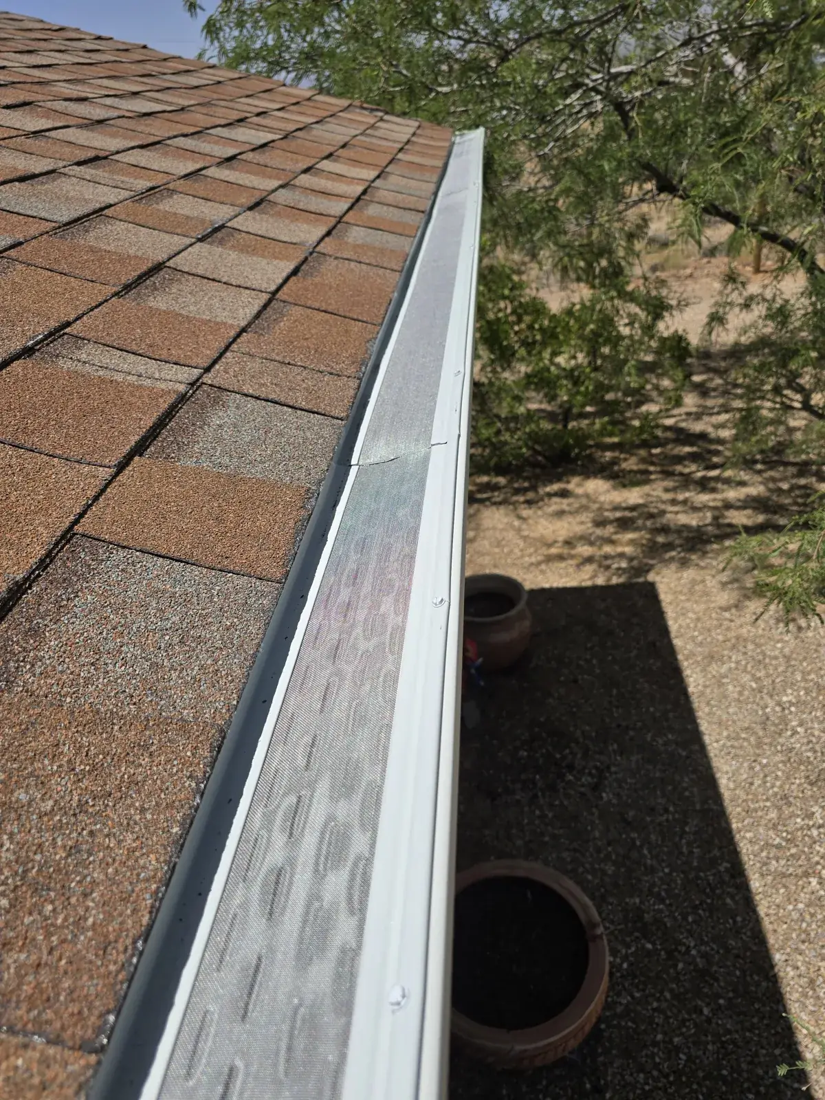 Fine micro-mesh gutter guard over a seamless gutter on a desert home in Kingman, AZ