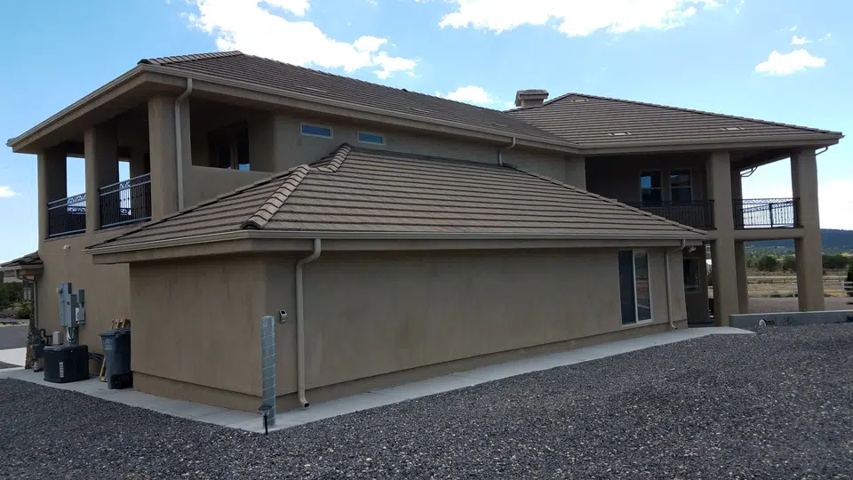 Finished roofline gutter installation on a Southwest home