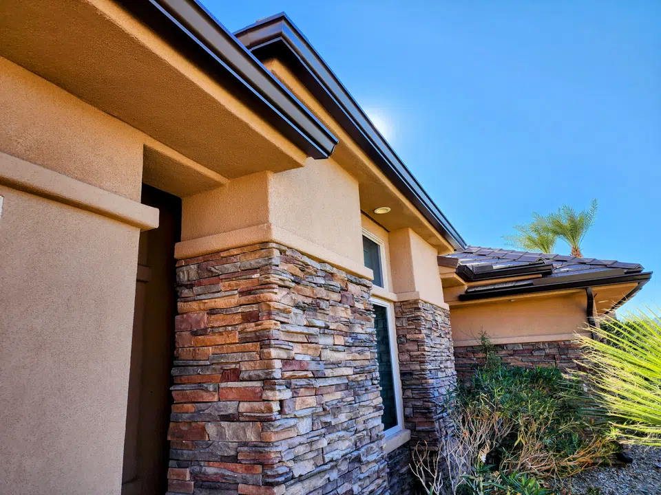 Eave line after seamless gutter installation