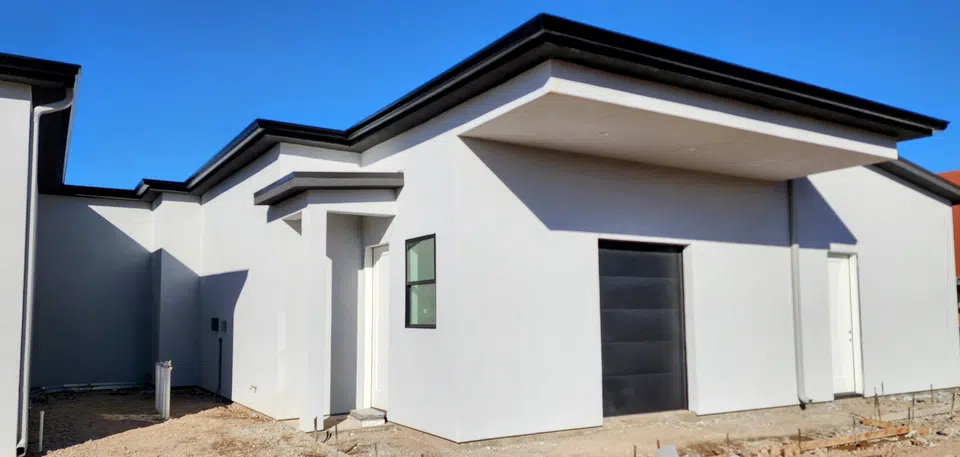 Rain gutter and downspout installation, completed work