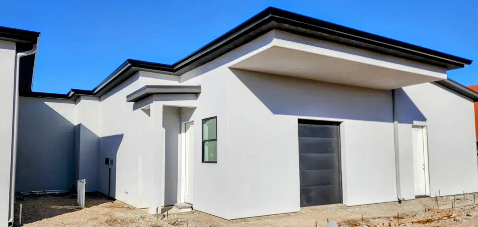 Eave line after seamless gutter installation