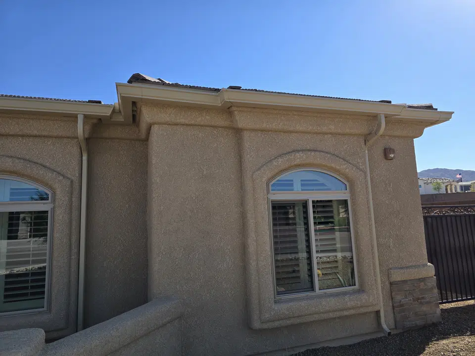 Roofline with newly installed seamless gutters