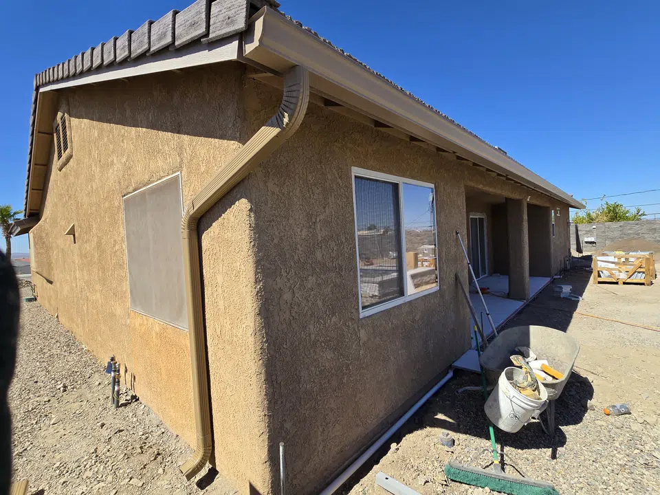 Roofline with newly installed seamless gutters
