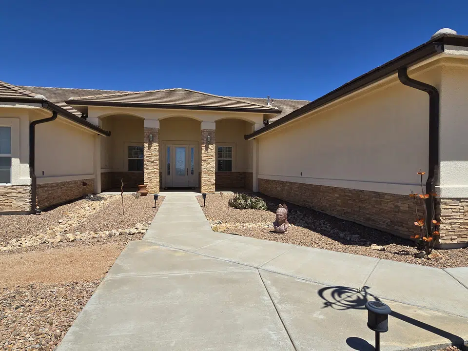 Finished roofline gutter installation on a Southwest home