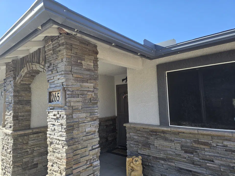 Finished roofline gutter installation on a Southwest home