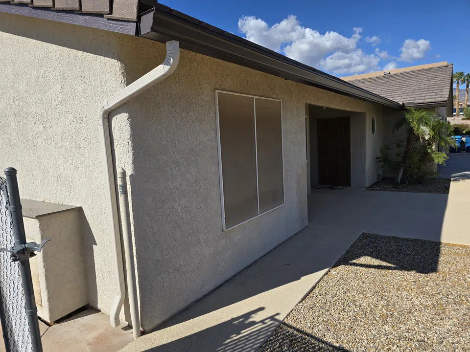 Finished roofline gutter installation on a Southwest home