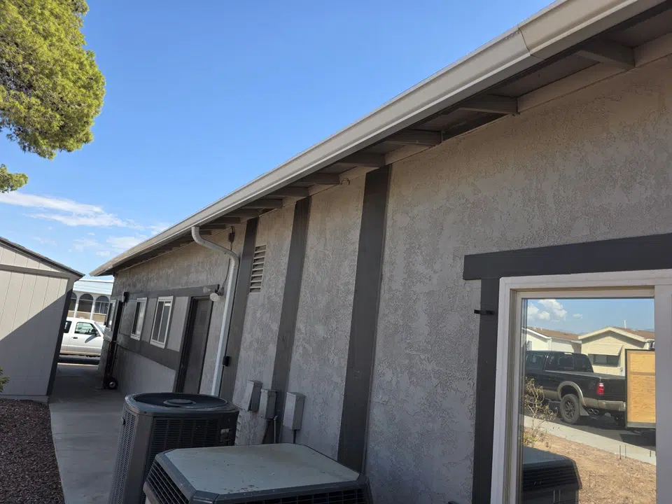 Eave line after seamless gutter installation
