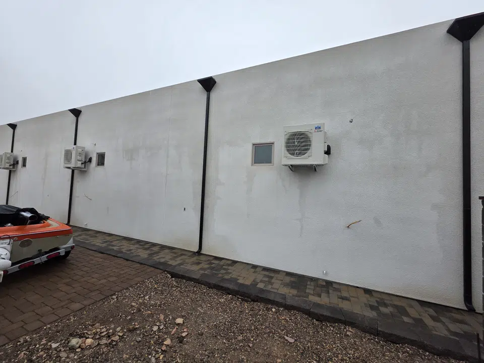 Eave line after seamless gutter installation