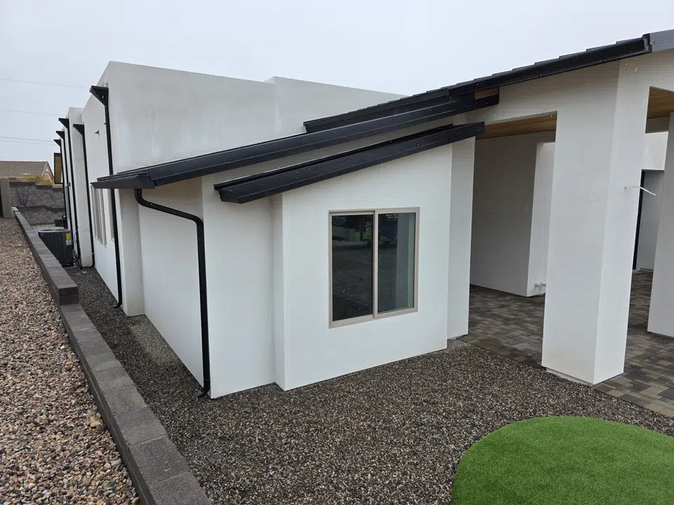 Finished roofline gutter installation on a Southwest home